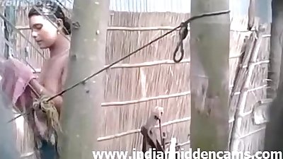 Indian amateur village girl outdoor shower - indianhiddencams.com